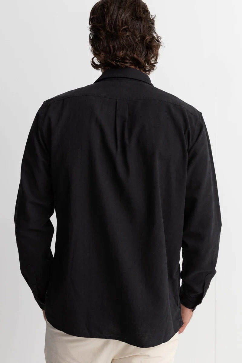 The back of a man wearing a rhythm classic linen long sleeve shirt in black