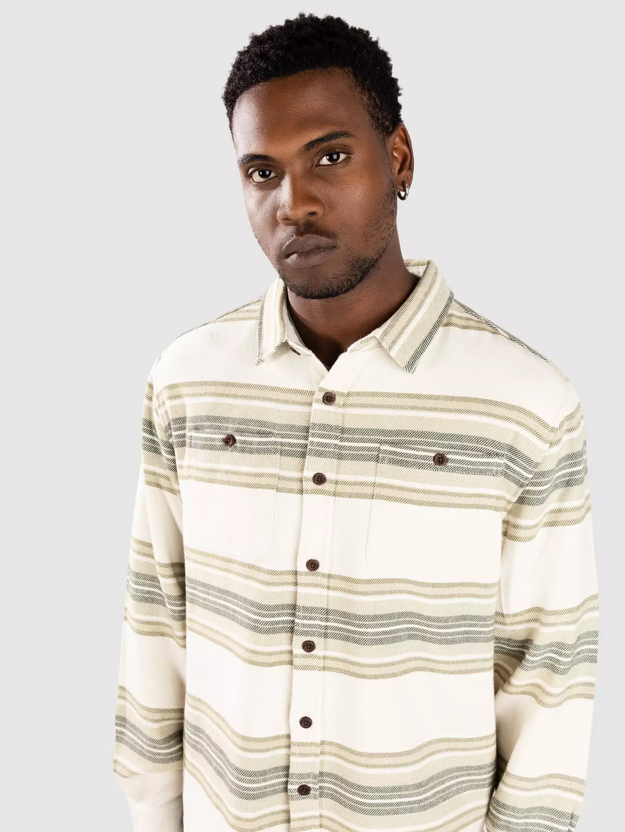 Man wearing a katin sierra flannel shirt in grey on a white background