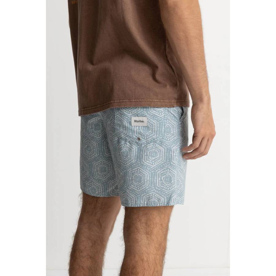 the back of a man wearing rhythm gleam trunks