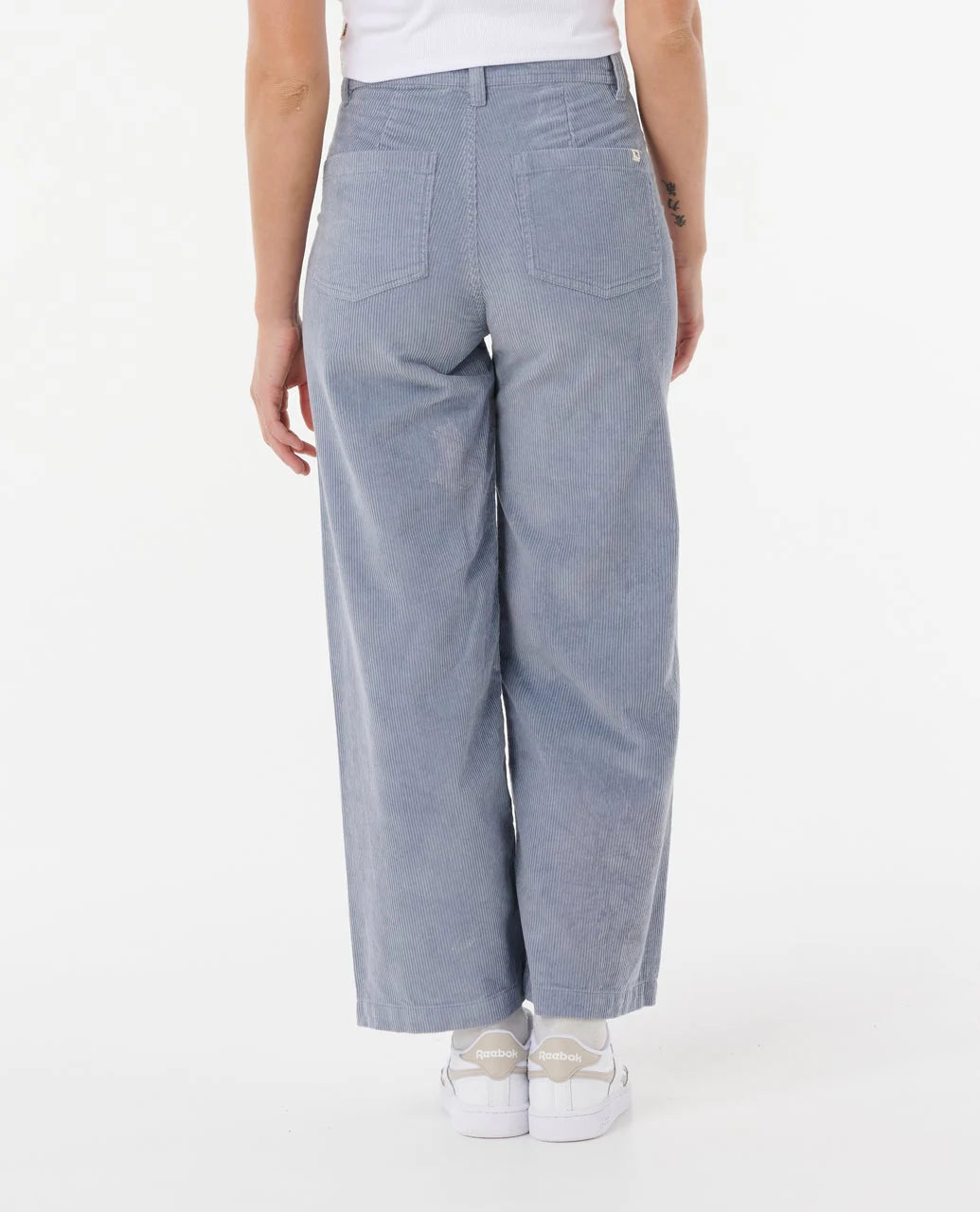 Light blue pants worn by a person on a white background