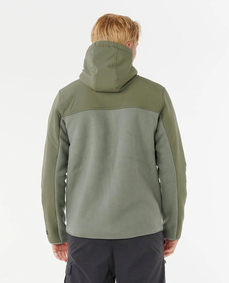 Person wearing a rip curl anti series fleece green jacket with a hood on a white background