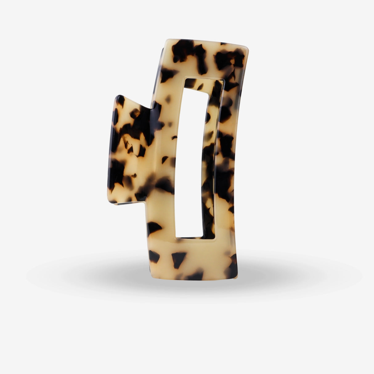 cheetah hair clip on a white background