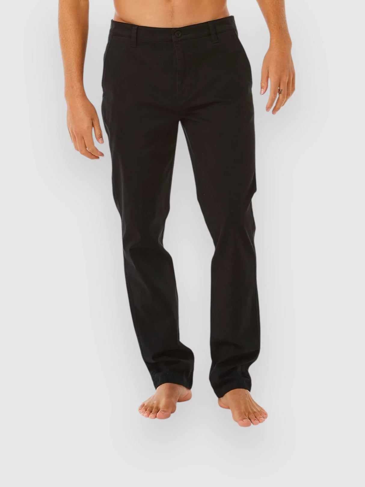 Person wearing rip curl classic surf chino black pants on a white background
