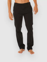 Person wearing rip curl classic surf chino black pants on a white background