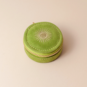 cai and jo Green round jewelry box with sun design on a beige background