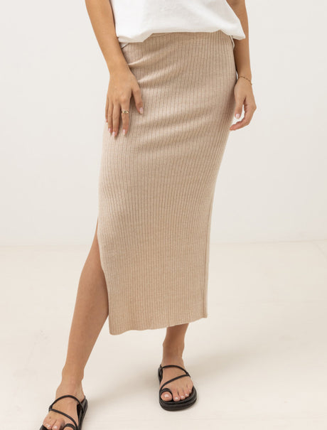 woman wearing rhythm hayman knit midi skirt against a white background