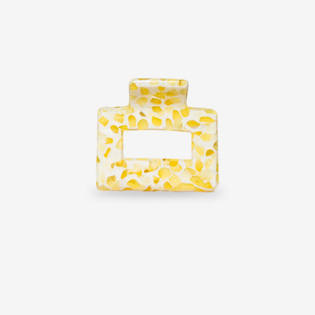 Yellow textured square sasstie hair clip on a white background