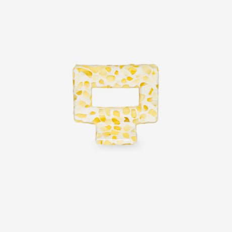 Yellow square-shaped hair clip on a white background